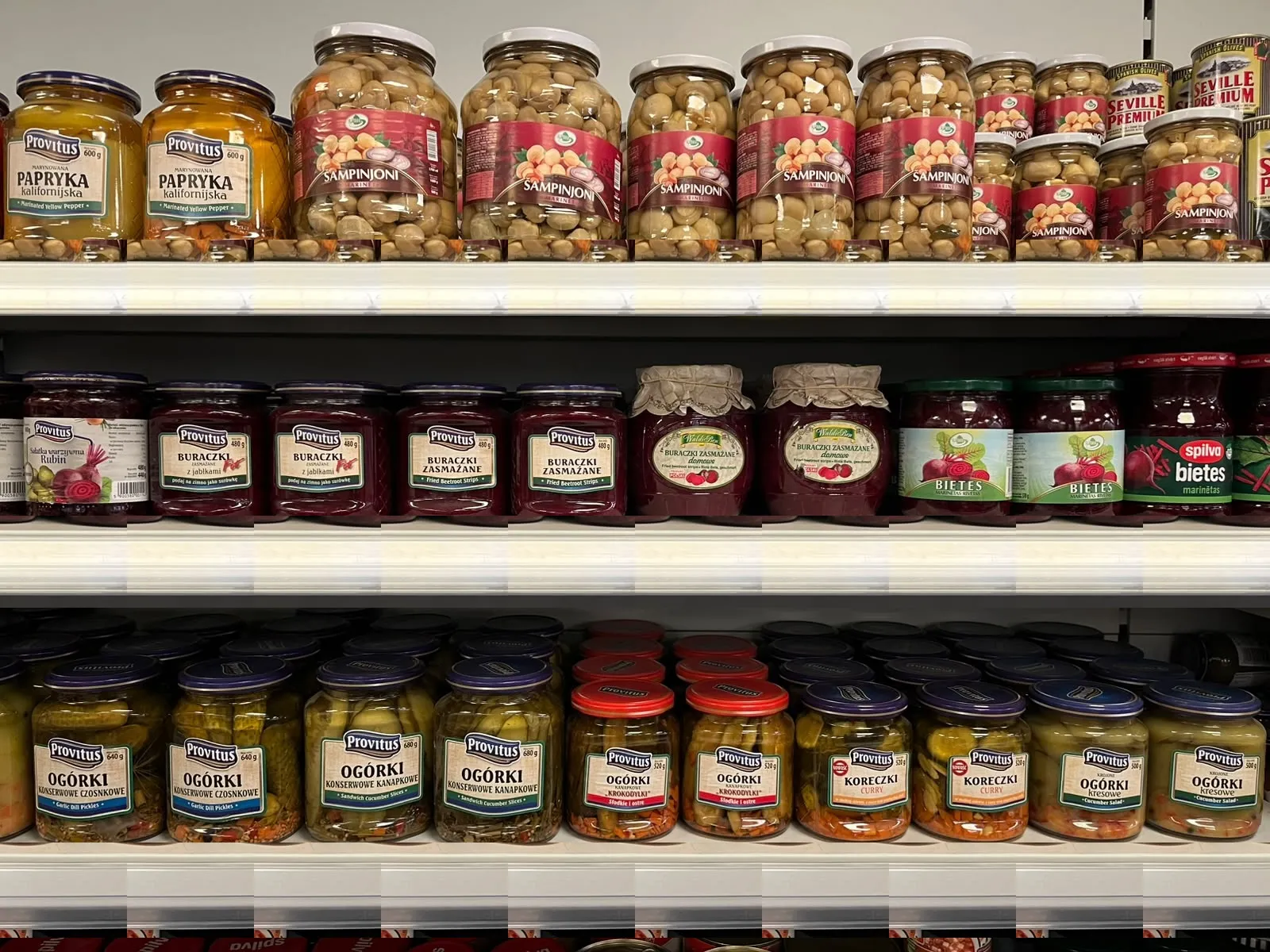 Provitus pickled cucumbers, stewed beetroot and marinated peppers in jars on a shop shelf